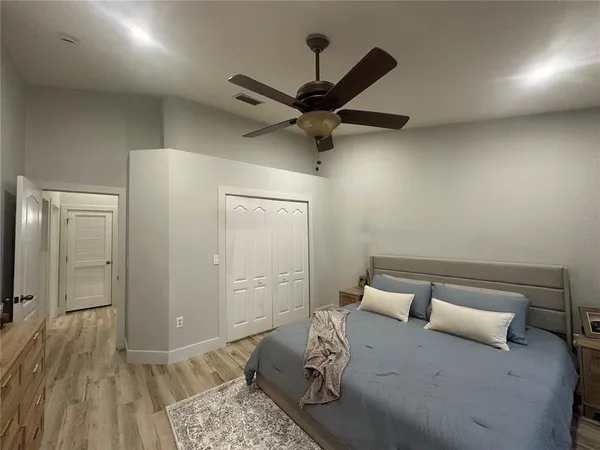 a bedroom with a bed and a walk in closet