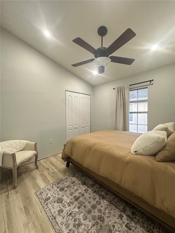 7544 Red Mill Circle New Port Richey, FL 34653 - Photo 29 of 31 a bedroom with a bed and a window