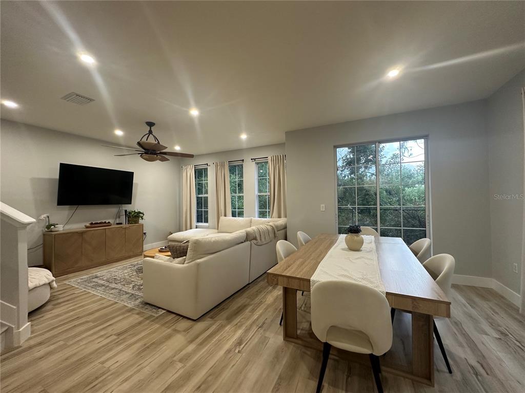 7544 Red Mill Circle New Port Richey, FL 34653 - Photo 5 of 31 a living room with furniture and a flat screen tv