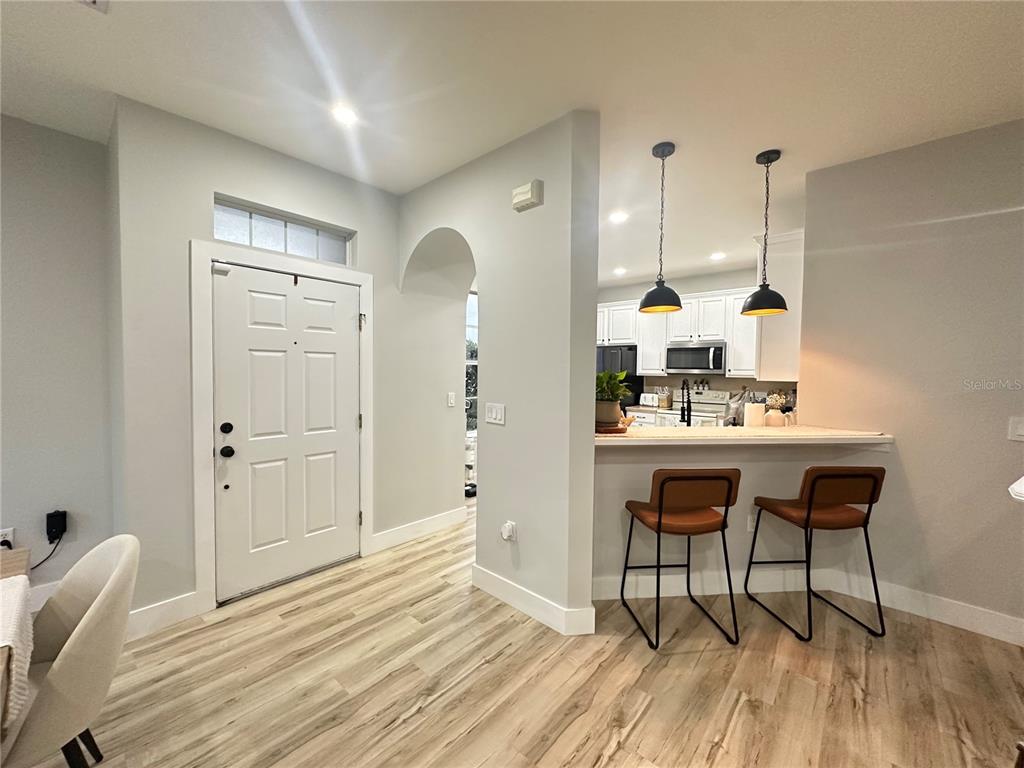 7544 Red Mill Circle New Port Richey, FL 34653 - Photo 9 of 31 a bathroom with a sink a mirror and a shower