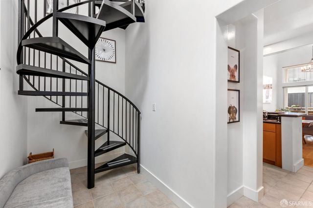 a view of staircase with furniture and stairs