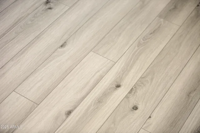a view of staircase with wooden floor and white walls