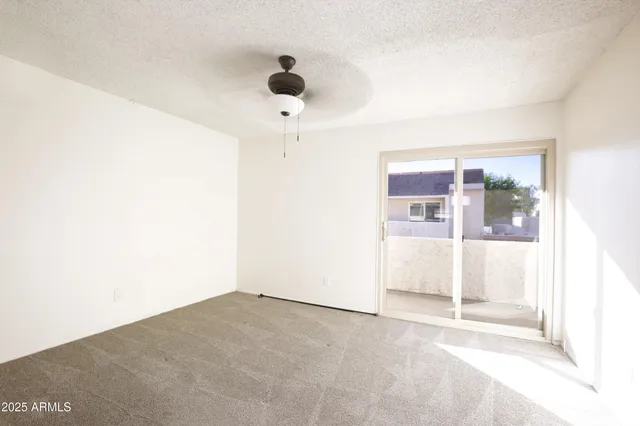 a kitchen with a sink a refrigerator a microwave and cabinets