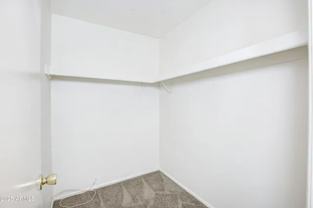 a view of a hallway with closet