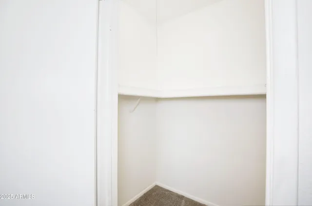 a bathroom with a shower a toilet and a sink