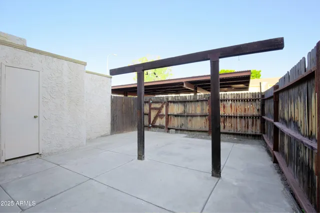 a view of a swimming pool with a patio