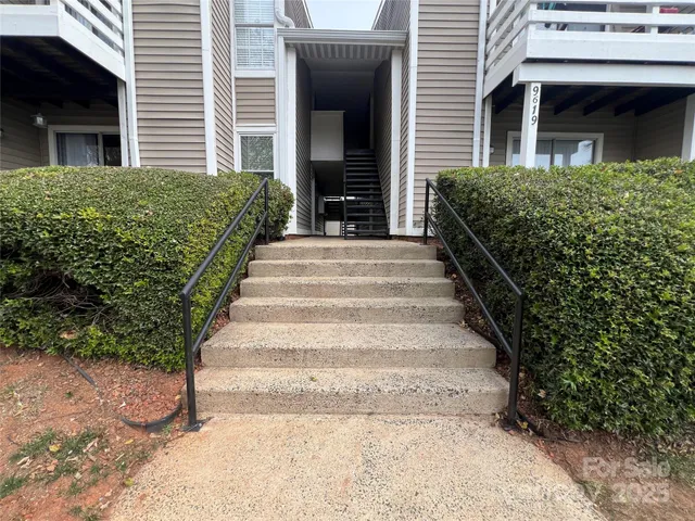 a view of a pathway of the house and front of a house