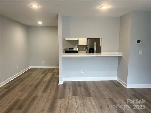 a view of kitchen with wooden floor