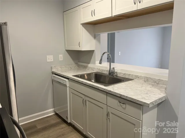 a kitchen with a sink and cabinets