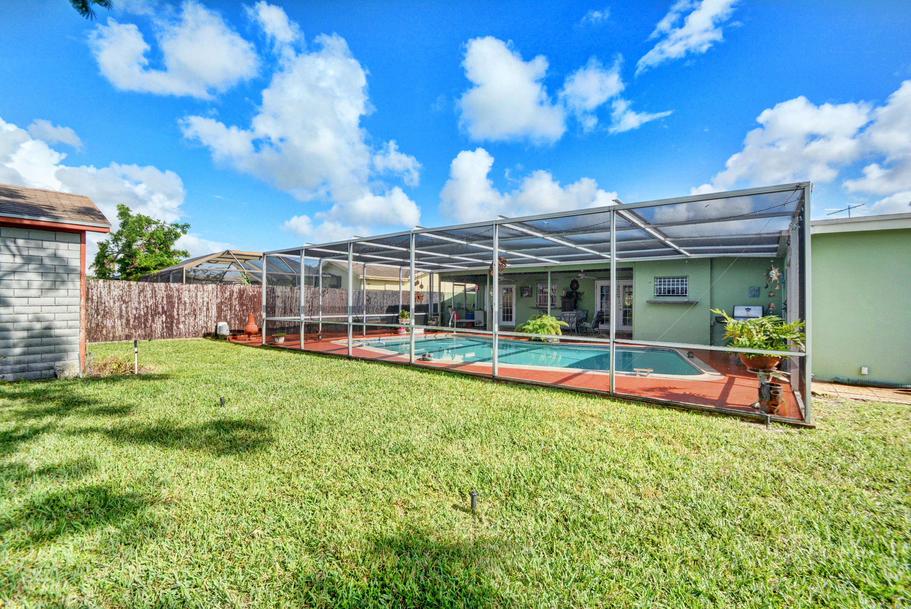 22349 Southwest 65th Avenue Boca Raton, FL 33428 - Photo 4 of 40 Screned in pool