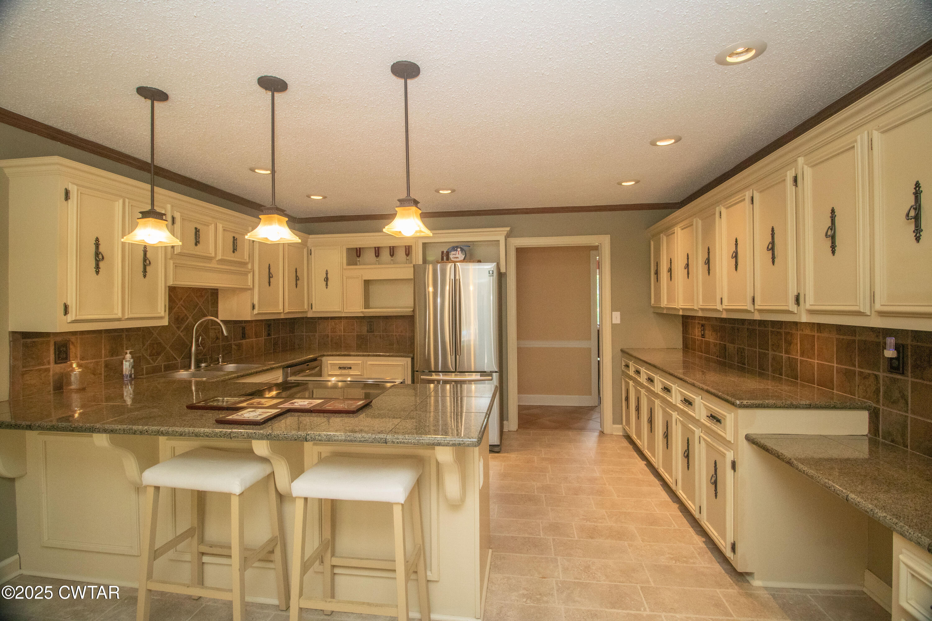 23 Forked Oak Road Humboldt, TN 38343 - Photo 14 of 90 a kitchen with stainless steel appliances kitchen island granite countertop a sink and cabinets
