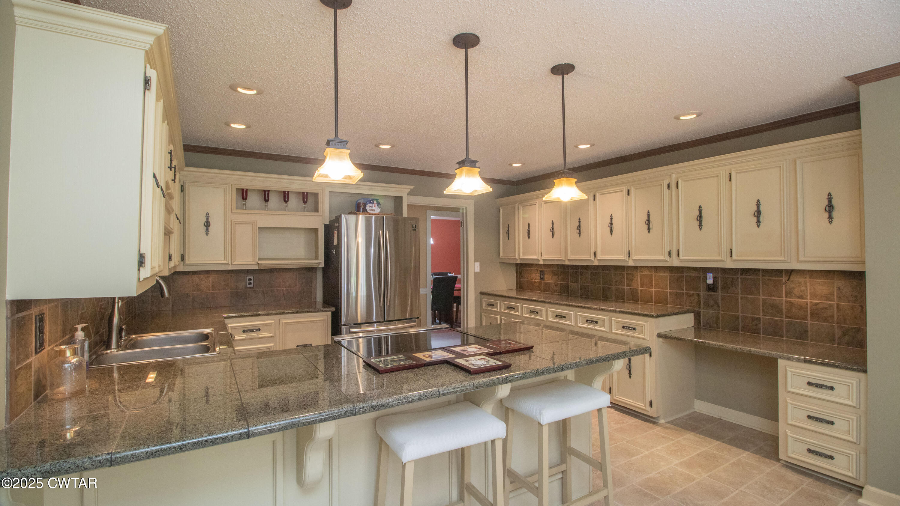 23 Forked Oak Road Humboldt, TN 38343 - Photo 17 of 90 a kitchen with kitchen island a sink stainless steel appliances and a counter top space