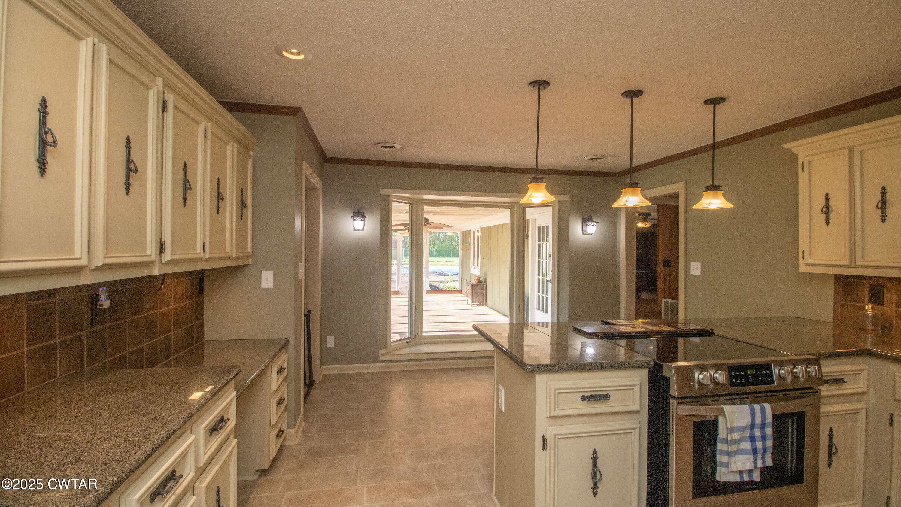 23 Forked Oak Road Humboldt, TN 38343 - Photo 19 of 90 a kitchen with stainless steel appliances granite countertop a sink a stove and a wooden floors