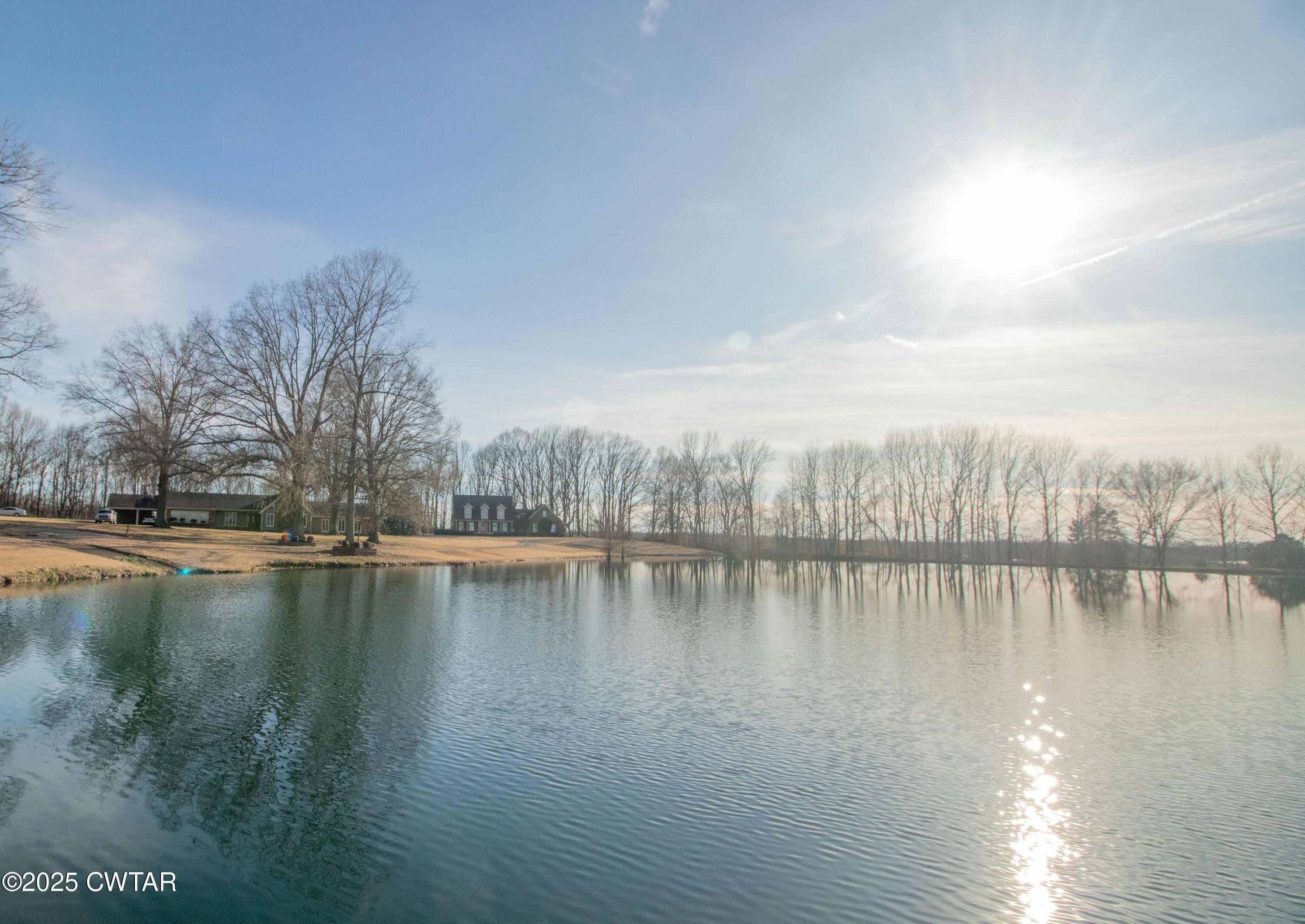 23 Forked Oak Road Humboldt, TN 38343 - Photo 34 of 90 a view of a lake with houses in the back