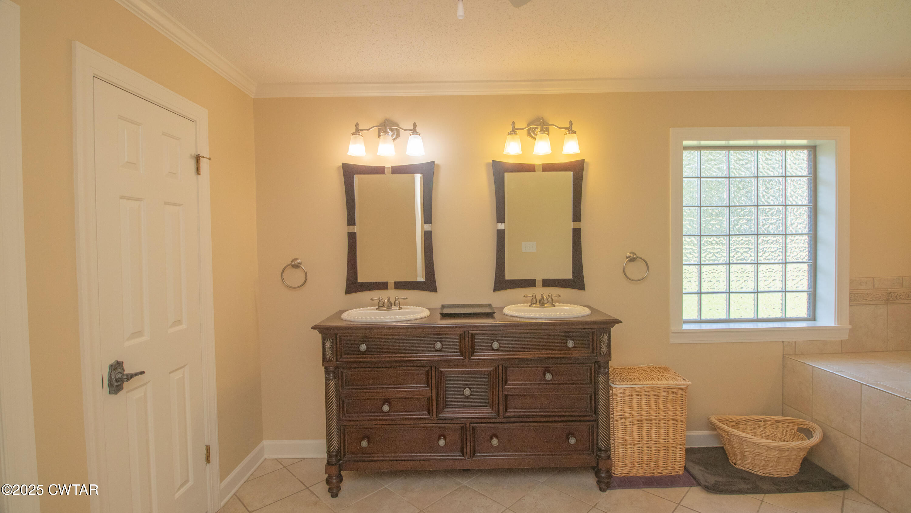 23 Forked Oak Road Humboldt, TN 38343 - Photo 39 of 90 a bathroom with a double vanity sink and a mirror