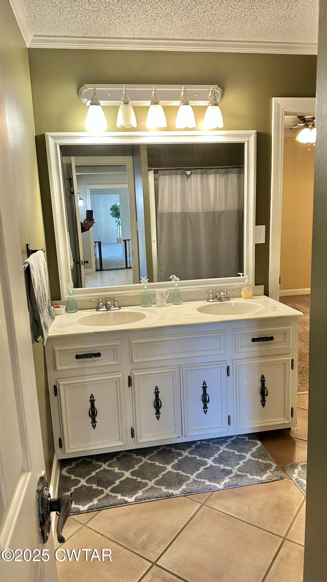 23 Forked Oak Road Humboldt, TN 38343 - Photo 49 of 90 a bathroom with a sink and a mirror