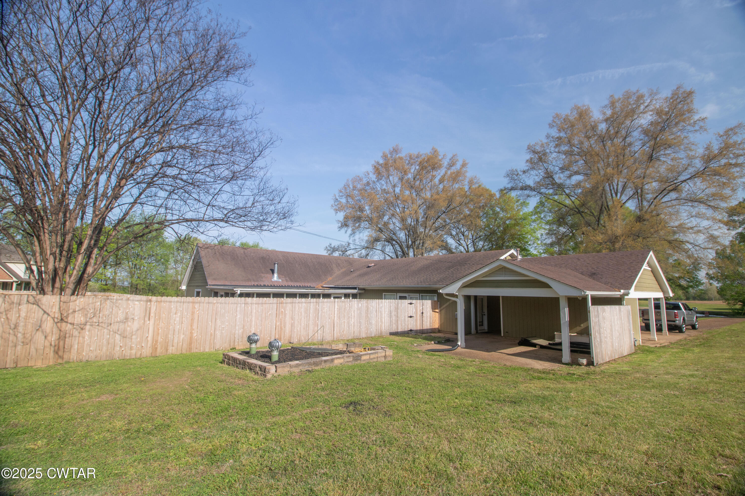 23 Forked Oak Road Humboldt, TN 38343 - Photo 89 of 90 a front view of a house with a garden and deck