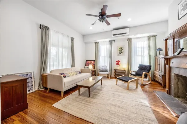 a living room with furniture and a fireplace