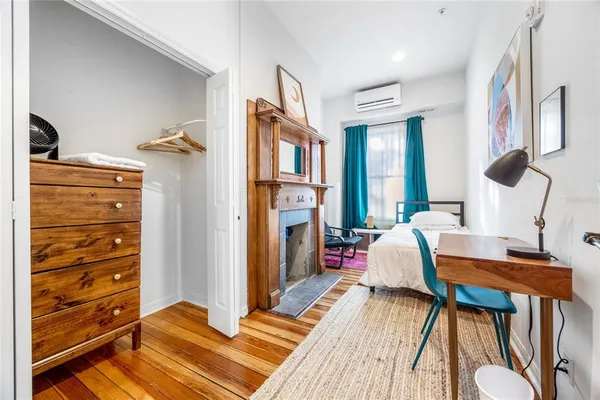 a bathroom with a shower sink and mirror