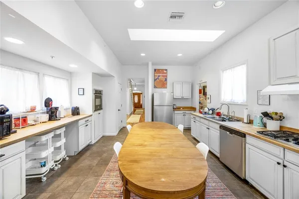 a bedroom with a bed and a table