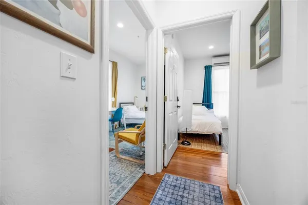 a bedroom with a bed and windows