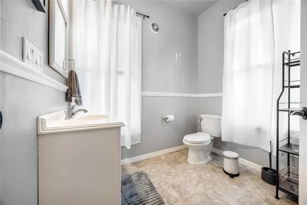 a view of a dining room with furniture and a window