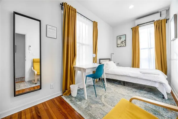 a bedroom with a bed and a fireplace