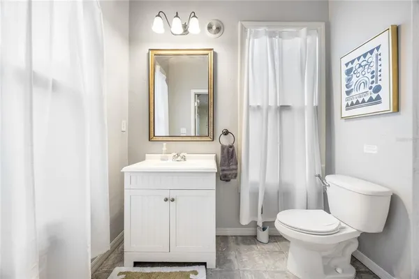 a view of a yard with large trees