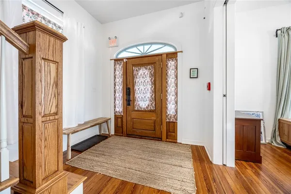 a living room with furniture fireplace and window