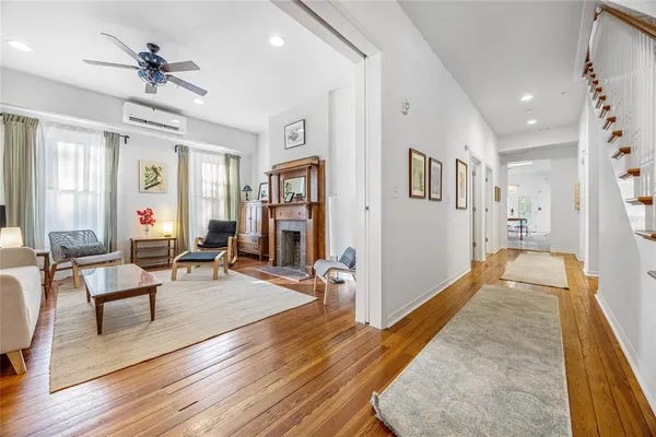 a living room with furniture and a fireplace