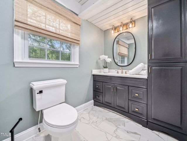 a bathroom with a bath tub with a shower