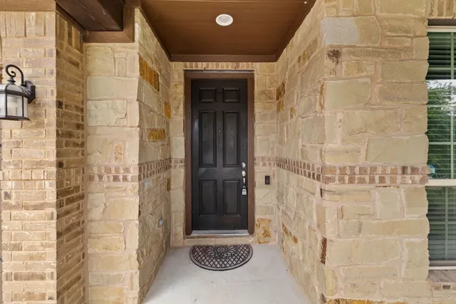a bathroom with a shower and a sink