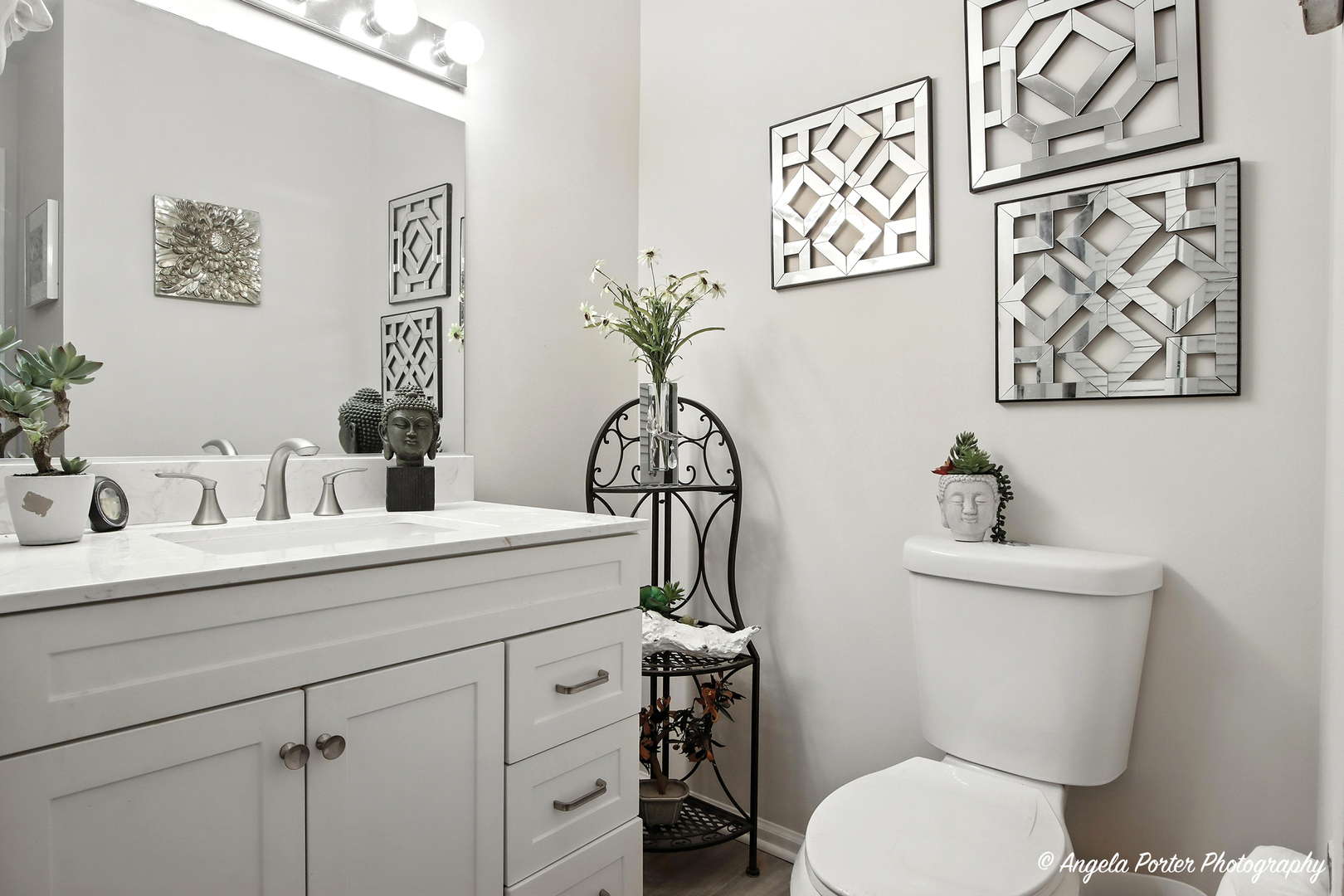 4119 White Ash Road Crystal Lake, IL 60014 - Photo 17 of 48 a bathroom with a toilet sink and mirror