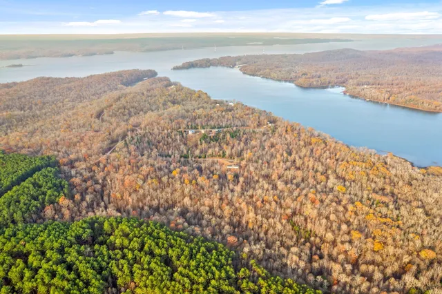 a view of a house with a lake view and a lake view