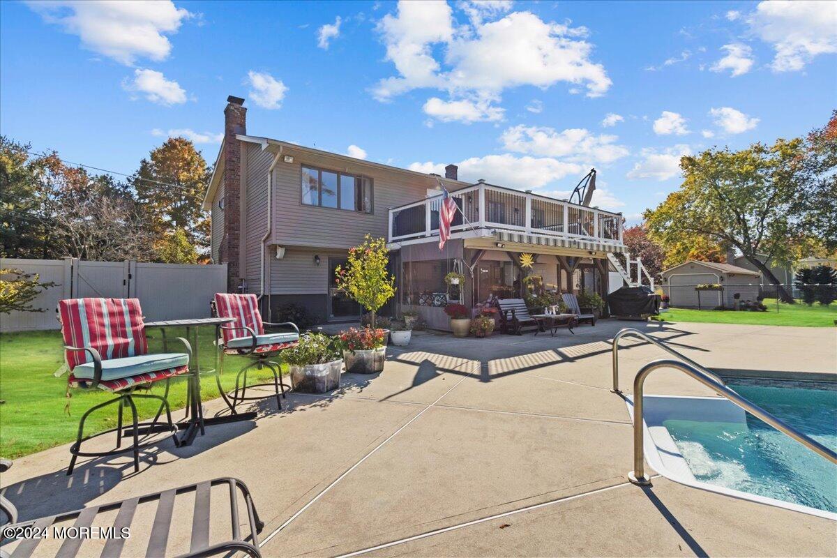 73 Sunnyside Road Howell, NJ 07731 - Photo 54 of 57 a front view of a house with swimming pool garden and patio