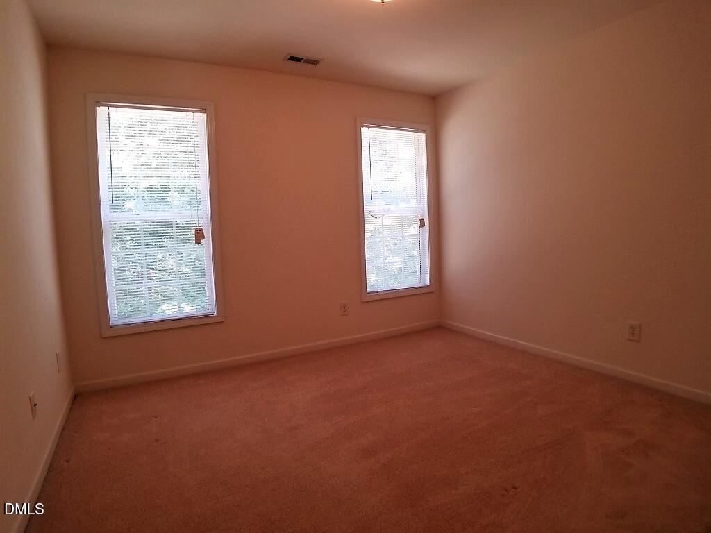 2100 Ramsgate Street Raleigh, NC 27603 - Photo 9 of 13 an empty room with windows