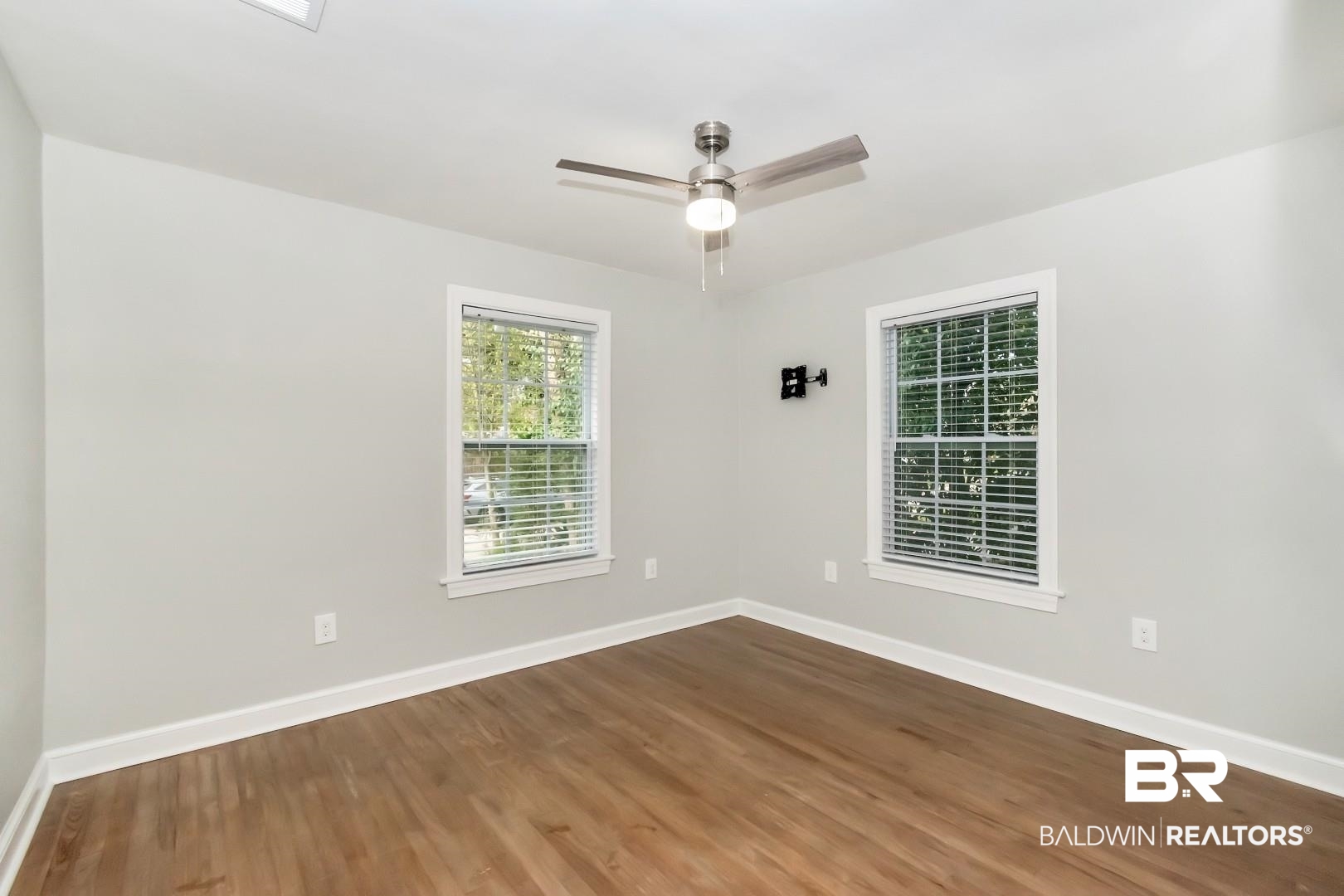 2157 Homewood Street Mobile, AL 36606 - Photo 25 of 36 Unfurnished room with a ceiling fan, baseboards, and wood finished floors