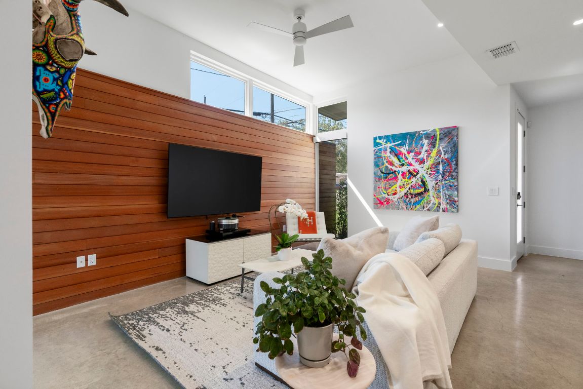 604 Cumberland Road Austin, TX 78704 - Photo 12 of 40 a living room with furniture and a flat screen tv