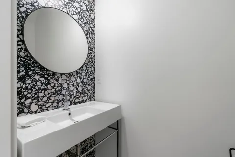 a bathroom with a sink and a mirror