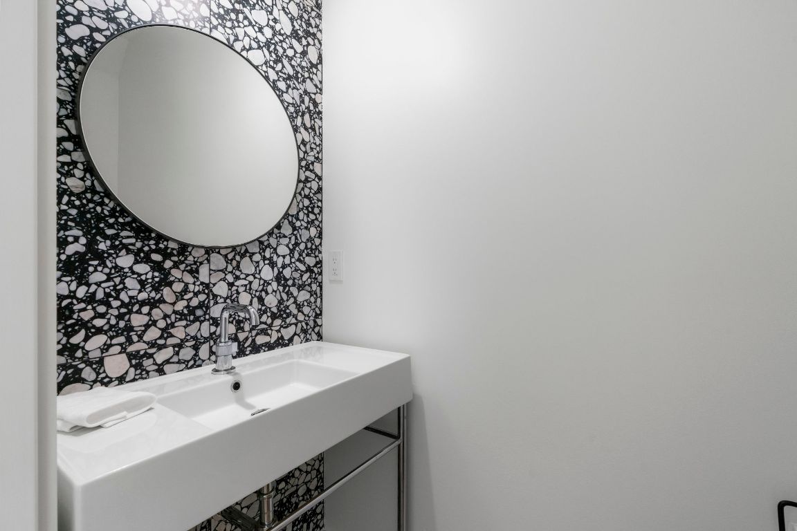 604 Cumberland Road Austin, TX 78704 - Photo 20 of 40 a bathroom with a sink and a mirror