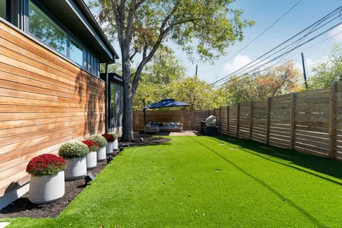 a view of a chair and tables back yard of the house