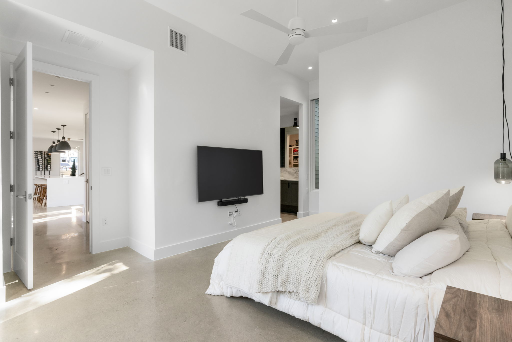 604 Cumberland Road Austin, TX 78704 - Photo 22 of 40 a bedroom with a bed and a flat screen tv
