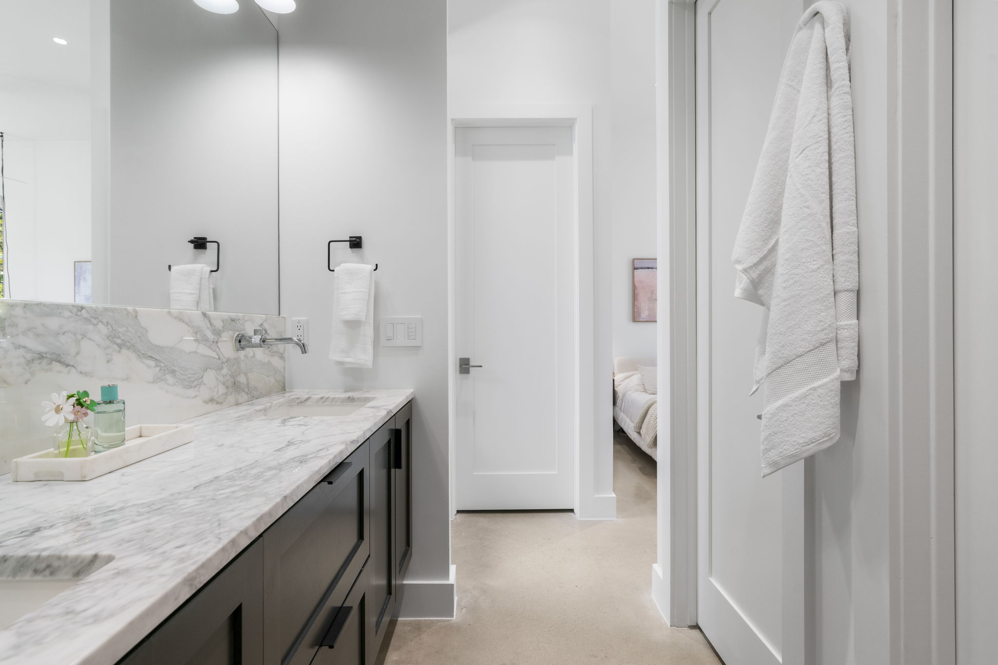 604 Cumberland Road Austin, TX 78704 - Photo 24 of 40 a en suite bathroom with a granite countertop sink and a mirror