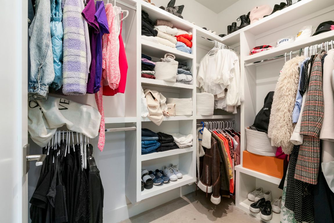 604 Cumberland Road Austin, TX 78704 - Photo 26 of 40 a view of walk in closet with clothes and shoes