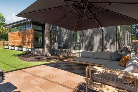 a view of a couches in patio of a house