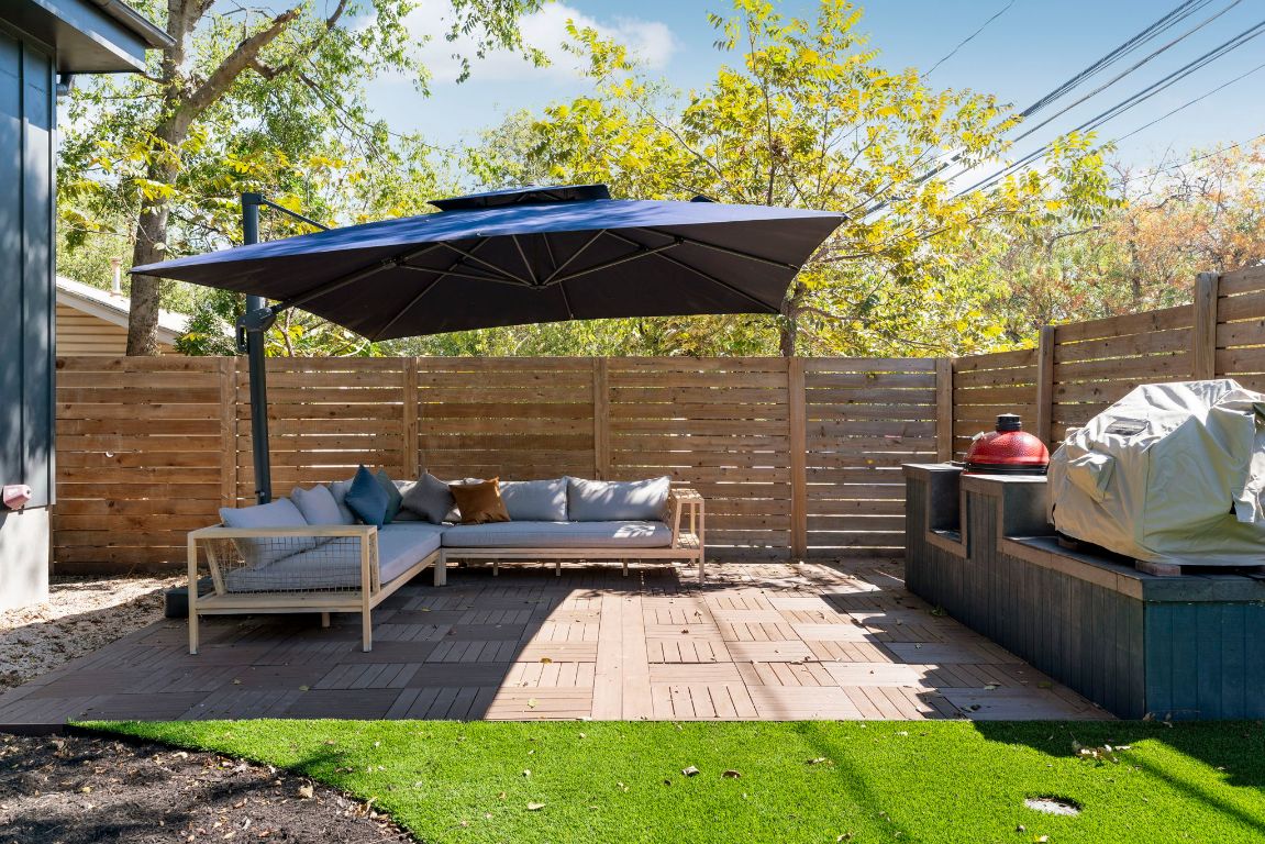 604 Cumberland Road Austin, TX 78704 - Photo 35 of 40 a view of a patio with a table and chairs under an umbrella