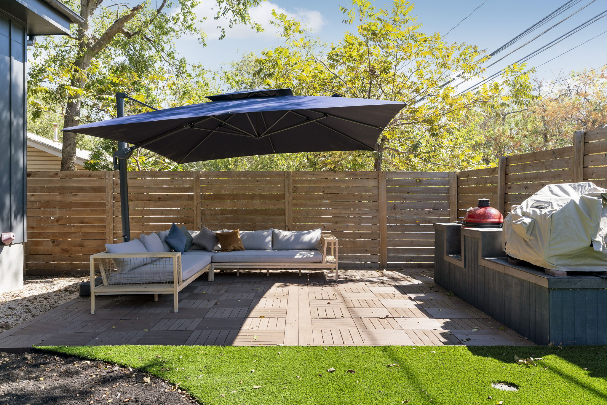 604 Cumberland Road Austin, TX 78704 - Photo 35 of 40 a view of a patio with a table and chairs under an umbrella