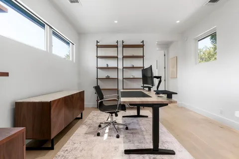 a view of a workspace with furniture