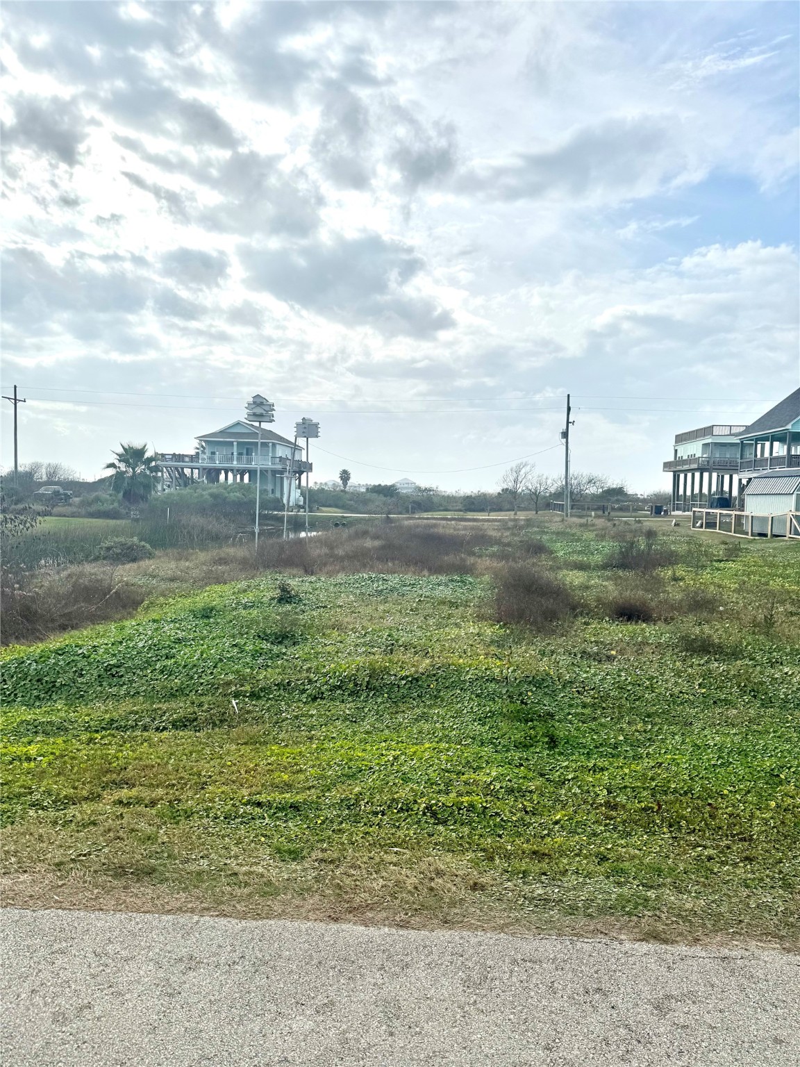 0 South Tinkle Lane Crystal Beach, TX 77650 - Photo 3 of 5 a view of a lake with a big yard