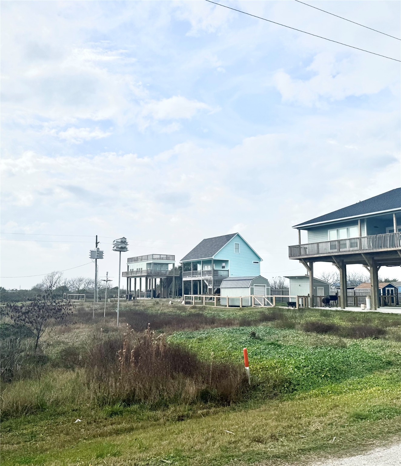 0 South Tinkle Lane Crystal Beach, TX 77650 - Photo 5 of 5 a view of houses with outdoor space and lake view